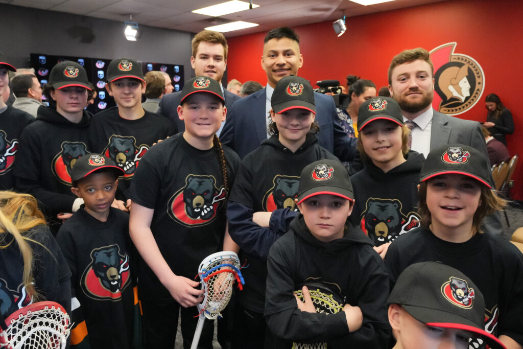 group of kids wearing black bears merch